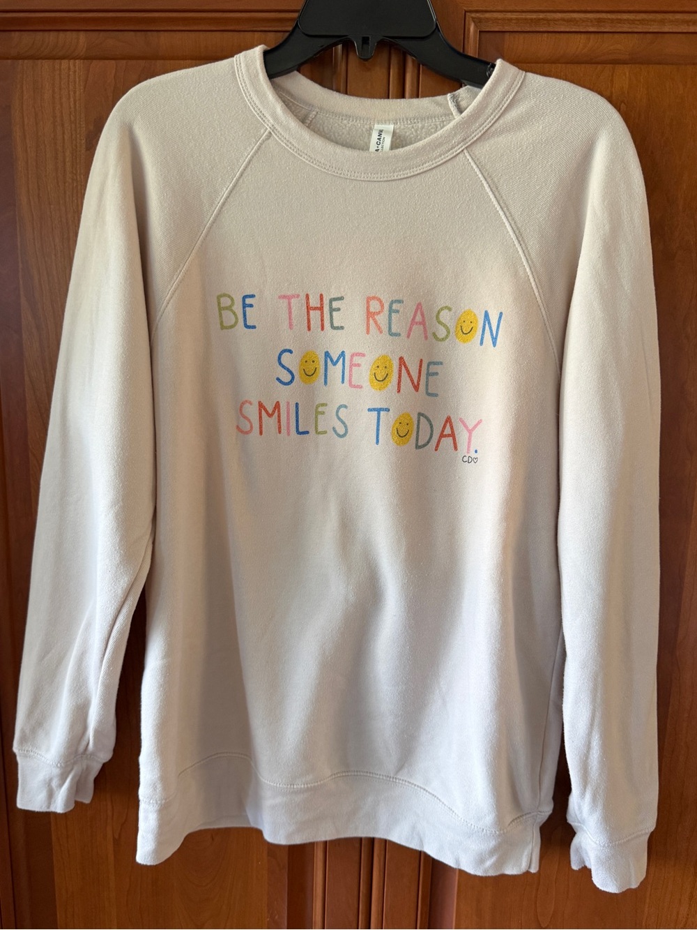 Bella+Canvas Be the Reason Someone Smiles Sweatshirt by Callie Danielle